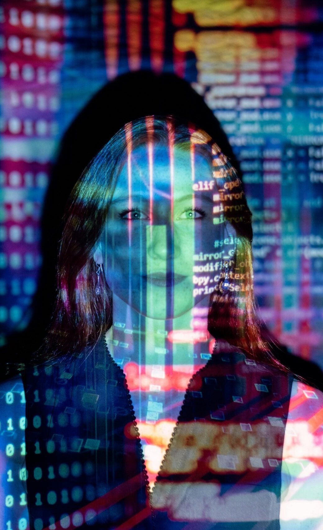 A woman with digital code projections on her face, representing technology and future concepts.